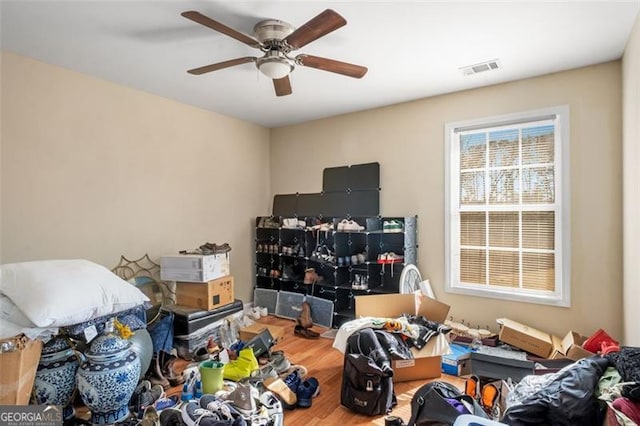 interior space with ceiling fan and hardwood / wood-style floors