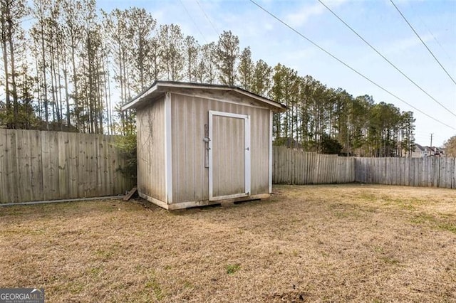 view of outbuilding featuring a yard