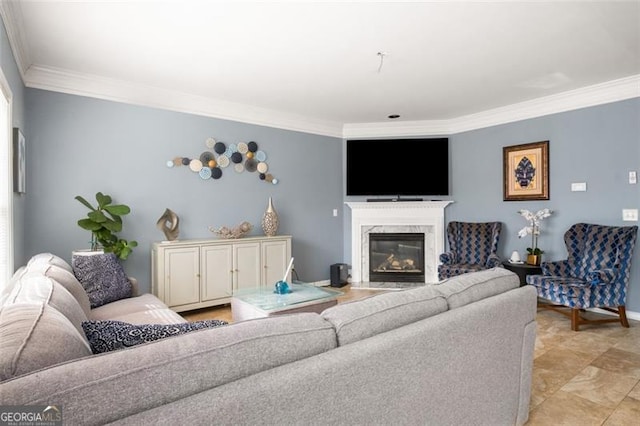 living room featuring a fireplace, plenty of natural light, and crown molding