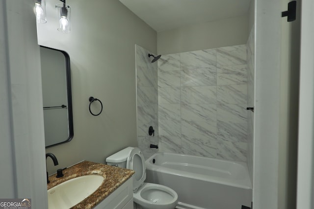 full bathroom featuring tiled shower / bath combo, vanity, and toilet