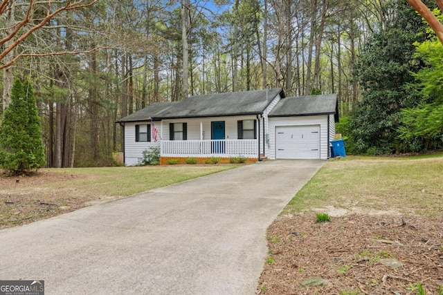 ranch-style house featuring a front lawn, a garage, and a porch