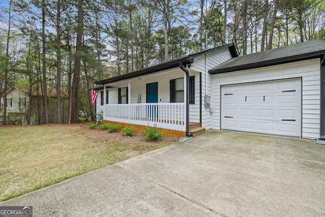 ranch-style home with a garage, a front yard, and a porch