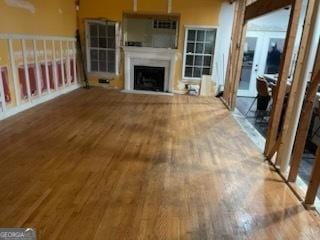 unfurnished living room with hardwood / wood-style floors