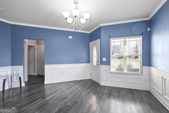 interior space with dark hardwood / wood-style flooring, crown molding, and a notable chandelier