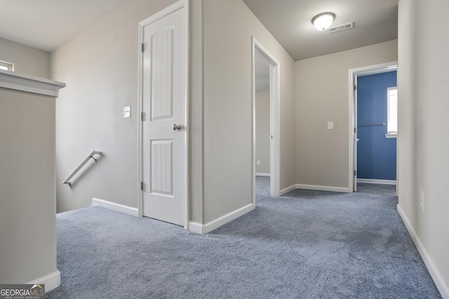 hallway featuring carpet flooring