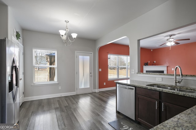 kitchen featuring light stone countertops, sink, a wealth of natural light, and stainless steel appliances