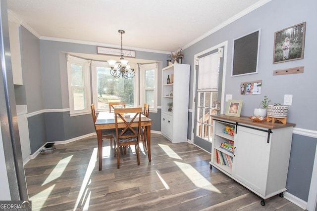 dining space with a notable chandelier, dark hardwood / wood-style flooring, and crown molding