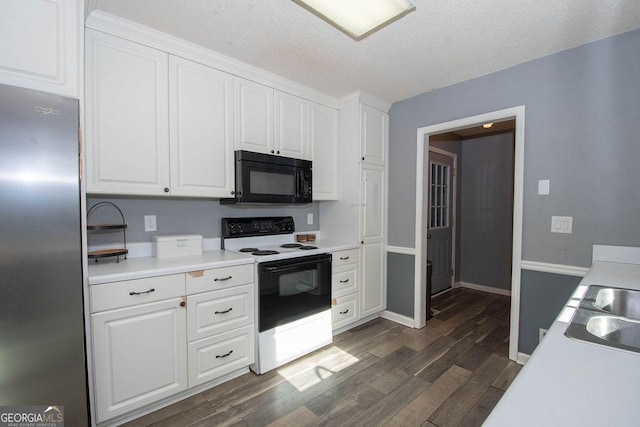 kitchen featuring range with electric cooktop, dark hardwood / wood-style floors, stainless steel refrigerator, a textured ceiling, and white cabinets