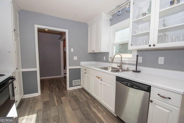 kitchen featuring dark hardwood / wood-style floors, stainless steel dishwasher, sink, white cabinetry, and range with electric cooktop