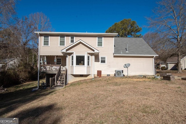 back of house featuring a lawn, central AC, and a deck