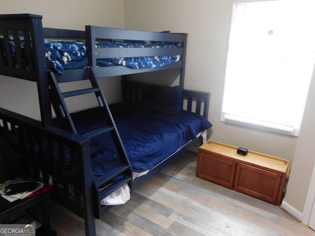 bedroom with hardwood / wood-style flooring