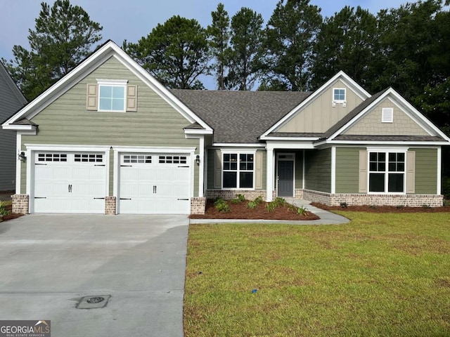 craftsman house with a garage and a front lawn