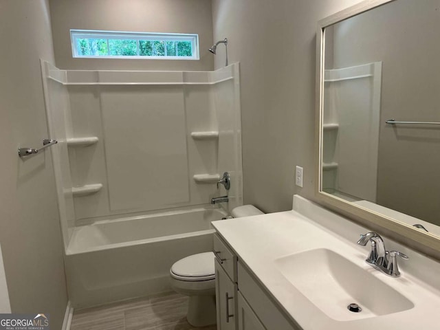 full bathroom with toilet, shower / washtub combination, and vanity