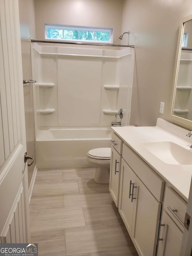 full bathroom with toilet, shower / bathtub combination, and vanity