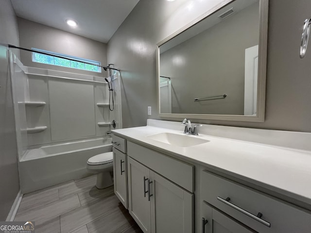 143 Madeira Dr, Brunswick, GA 31523 - bathroom featuring vanity, toilet, and bathtub / shower combination