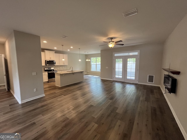 143 Madeira Dr, Brunswick, GA 31523 - unfurnished living room with a sink, ceiling fan, recessed lighting, baseboards, and dark wood-type flooring