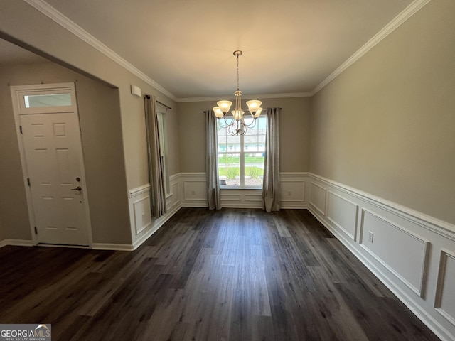 143 Madeira Dr, Brunswick, GA 31523 - unfurnished dining area with a chandelier, dark wood-type flooring, a wainscoted wall, ornamental molding, and a decorative wall
