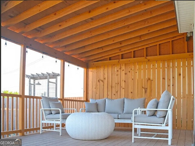 wooden terrace with an outdoor living space and a pergola