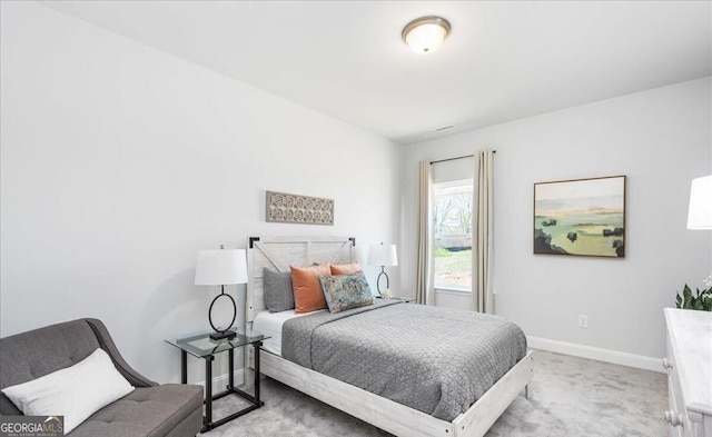 bedroom with light carpet