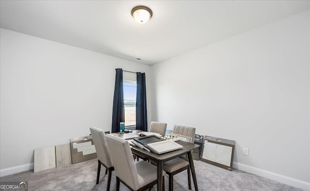 view of carpeted dining area