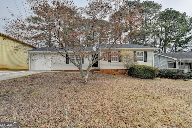 view of front of home with a garage and a front lawn