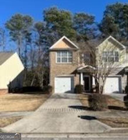 front of property with a garage