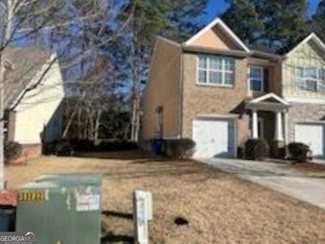 view of side of home featuring a garage