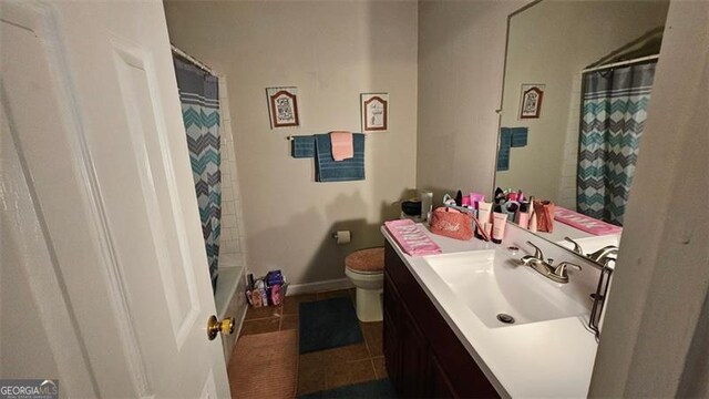 bathroom with tile patterned floors, toilet, and vanity