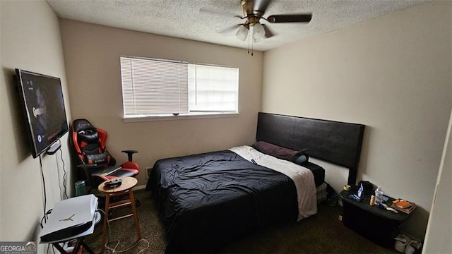 carpeted bedroom with ceiling fan and a textured ceiling