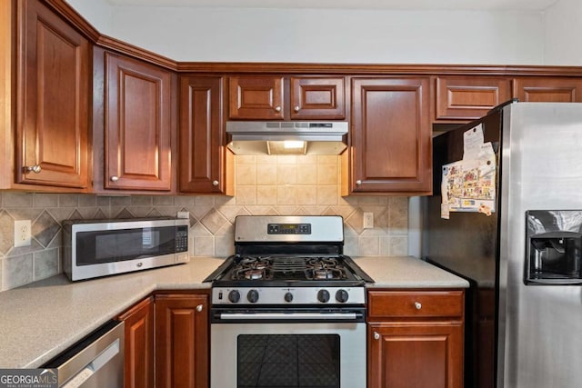 kitchen with tasteful backsplash and stainless steel appliances