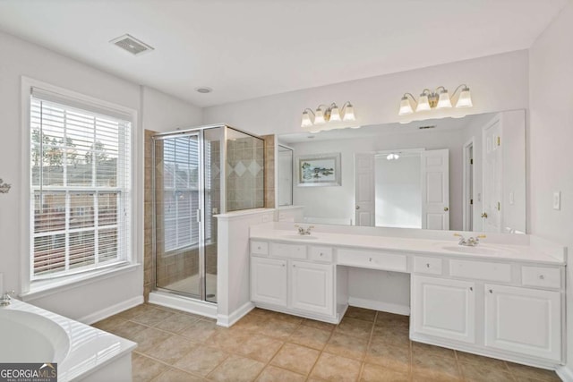 bathroom with independent shower and bath, tile patterned flooring, and vanity