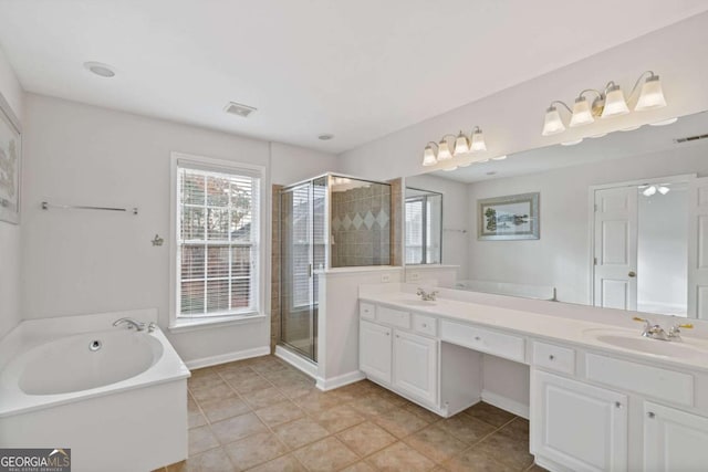 bathroom featuring tile patterned flooring, vanity, and plus walk in shower