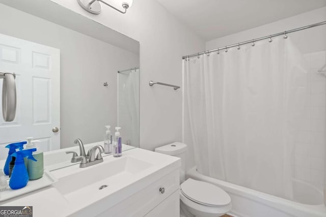 full bathroom featuring toilet, vanity, and shower / bath combination with curtain