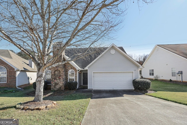 view of front of house with a front lawn and a garage