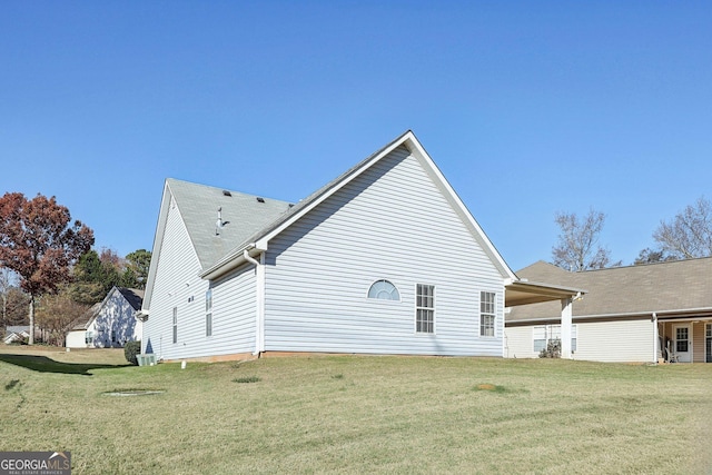 back of house with a yard