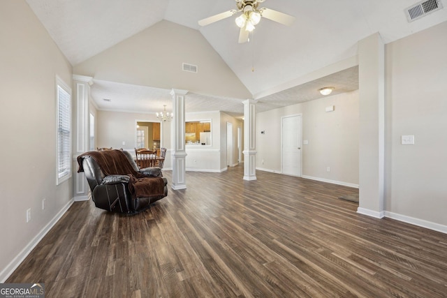 sitting room featuring vaulted ceiling, ceiling fan with notable chandelier, dark hardwood / wood-style floors, and decorative columns