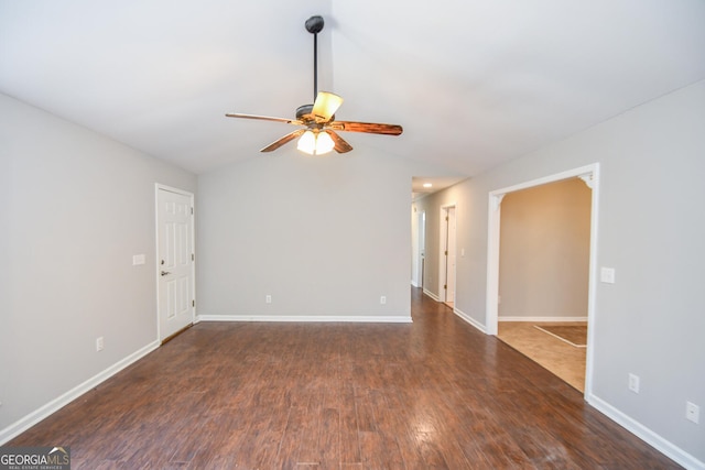 unfurnished room with ceiling fan, lofted ceiling, and dark hardwood / wood-style floors