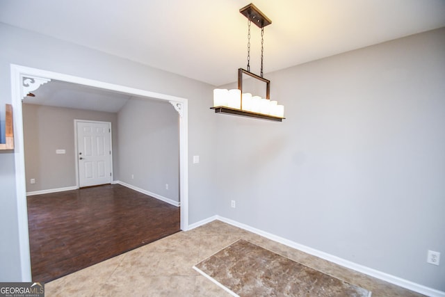 unfurnished dining area featuring dark wood-type flooring