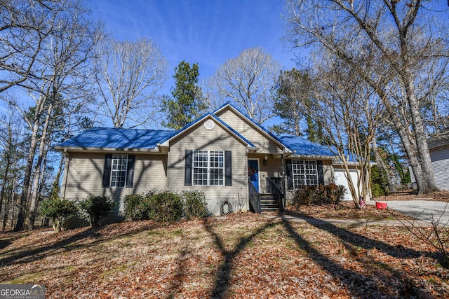 single story home featuring a garage