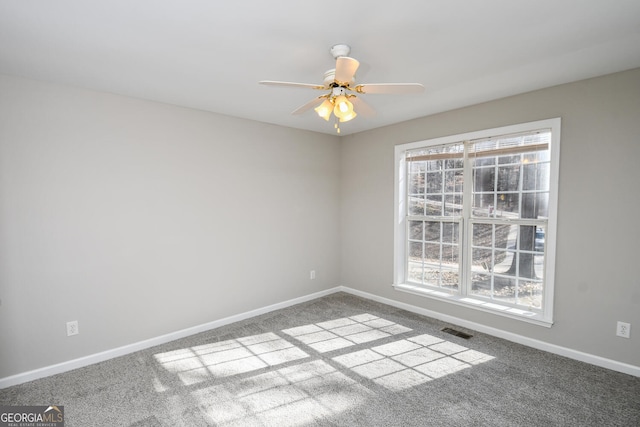 carpeted empty room with ceiling fan