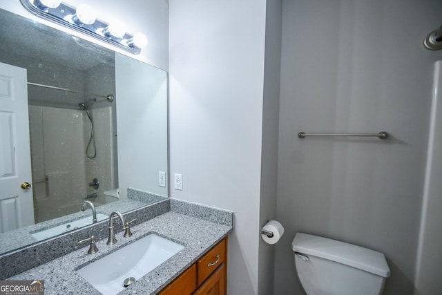 bathroom with toilet and vanity