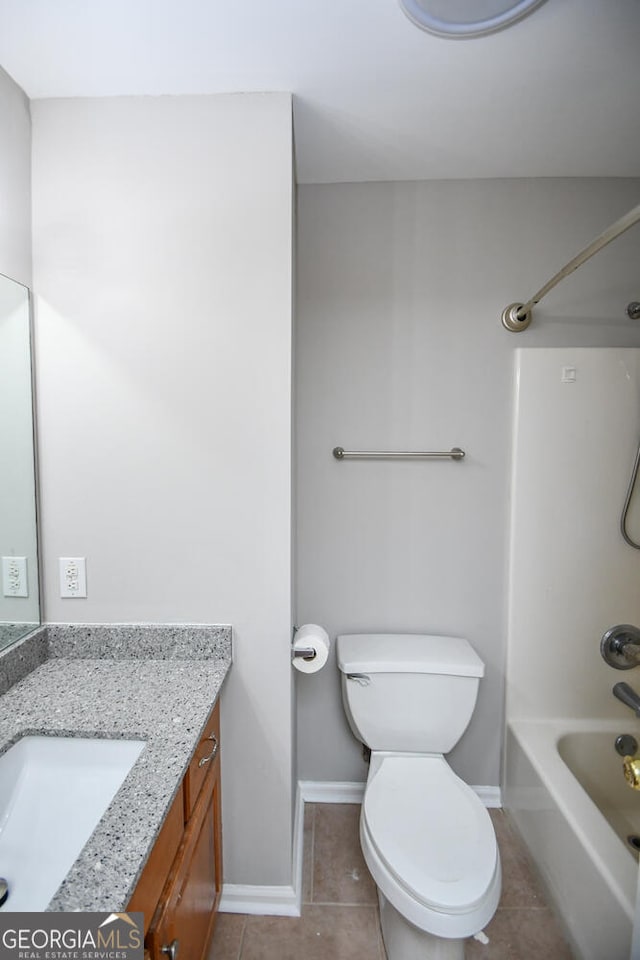 full bathroom with bathing tub / shower combination, toilet, vanity, and tile patterned flooring