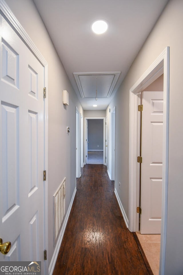 corridor featuring dark wood-type flooring