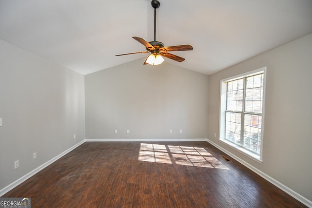 spare room with ceiling fan, lofted ceiling, and dark hardwood / wood-style floors