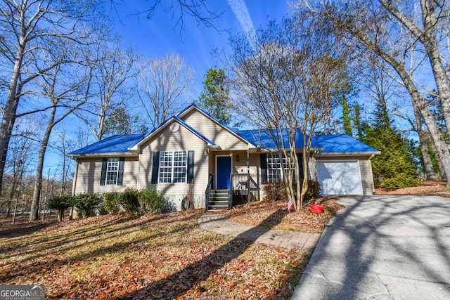 ranch-style house featuring a garage