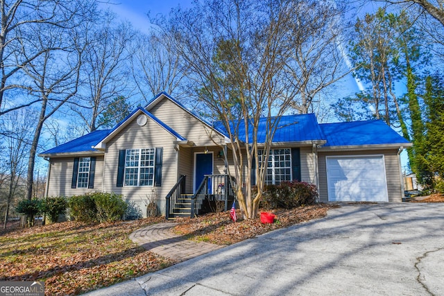 ranch-style home with a garage