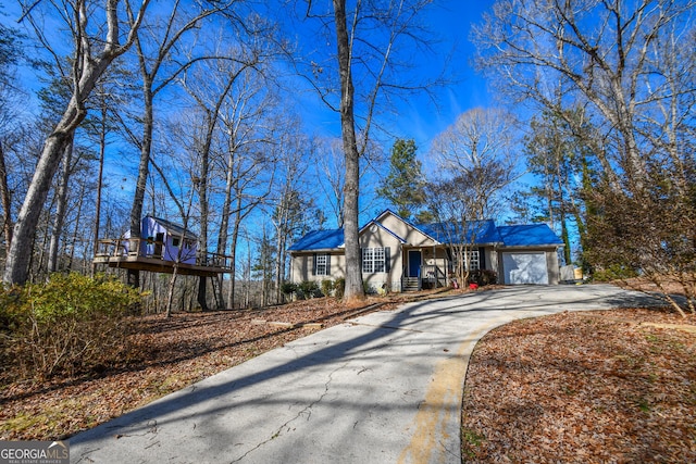 ranch-style home featuring a garage