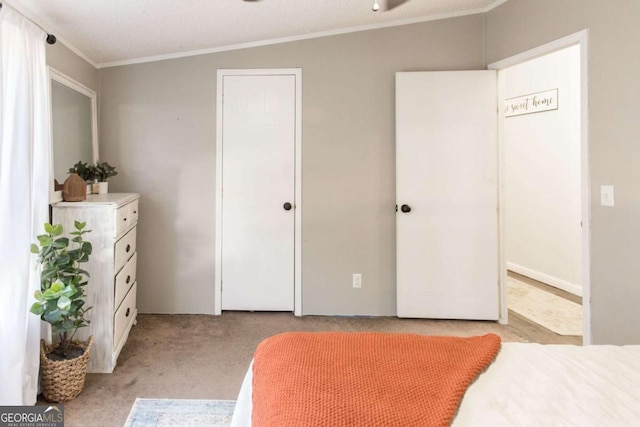 carpeted bedroom featuring a textured ceiling