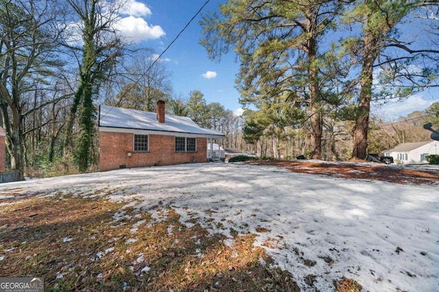 view of snow covered property