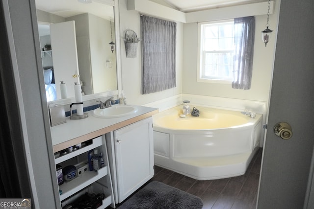 bathroom featuring a tub and vanity